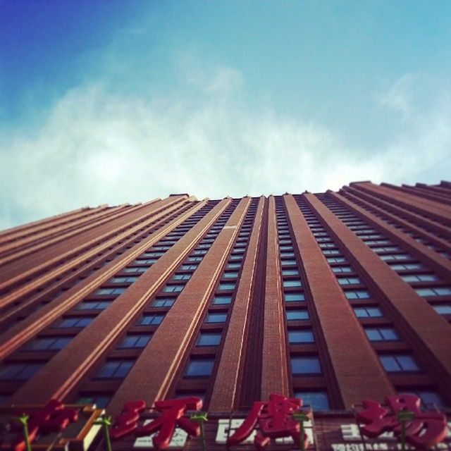 building exterior, low angle view, architecture, built structure, sky, city, building, cloud - sky, modern, cloud, window, day, outdoors, office building, no people, residential building, tall - high, blue, residential structure, facade