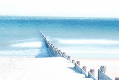 View of calm blue sea against clear sky