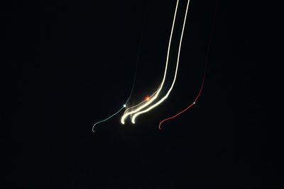 Low angle view of spider web against sky at night