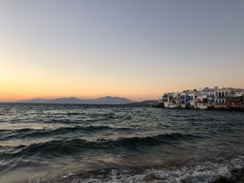 Scenic view of sea against clear sky during sunset