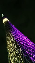 Low angle view of illuminated ferris wheel