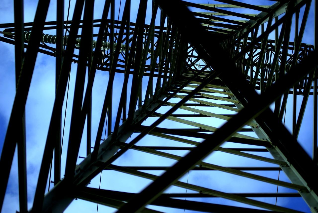 low angle view, connection, built structure, metal, engineering, bridge - man made structure, architecture, metallic, clear sky, sky, bridge, pattern, no people, day, grid, outdoors, support, sunlight, diminishing perspective, structure