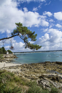 Scenic view of sea against cloudy sky
