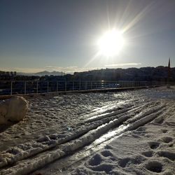 Frozen lake against sky during winter