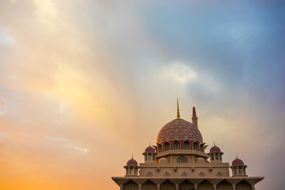 Low angle view of cathedral against cloudy sky