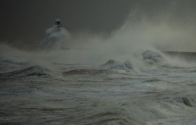 Tynemouth pier in storm arwen 