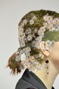 Double exposure photo of woman's head with flowers in her hair