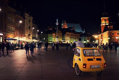 People on city street at night