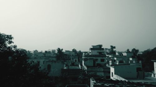 Residential district against clear sky