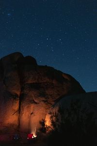 Scenic view of mountain against sky at night