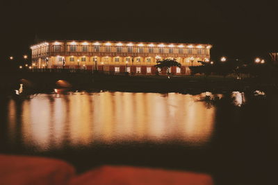 Reflection of buildings in city at night