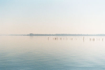 Scenic view of calm sea against clear sky