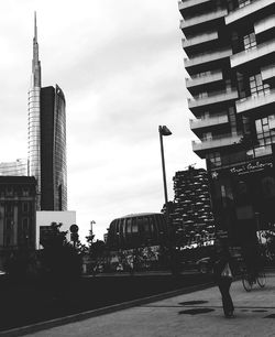 City skyline against cloudy sky