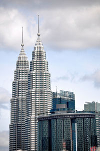 Modern building against cloudy sky