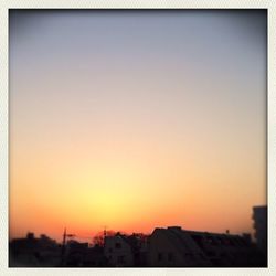 Built structure against clear sky at sunset