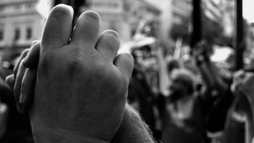 Close-up of hands against blurred background