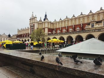 Buildings against cloudy sky