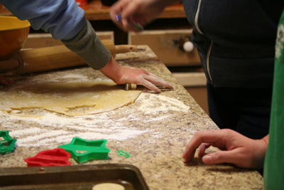 Midsection of man preparing food