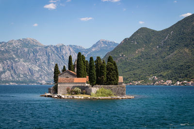 Scenic view of sea and buildings against sky
