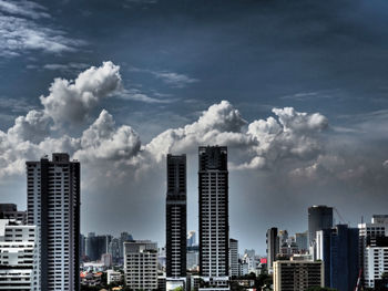 Modern buildings in city against sky