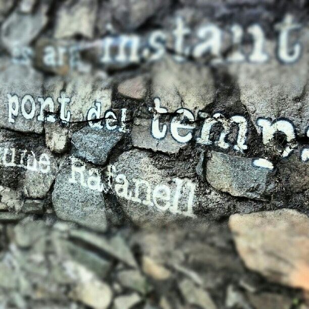 text, western script, close-up, communication, textured, wall - building feature, art, focus on foreground, creativity, selective focus, art and craft, day, outdoors, capital letter, pattern, love, non-western script, wall, no people, old