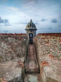 Built structure against cloudy sky