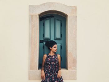 Woman in front of window