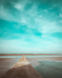 Surface level of beach against sky