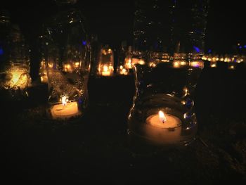 Lit candles in the dark