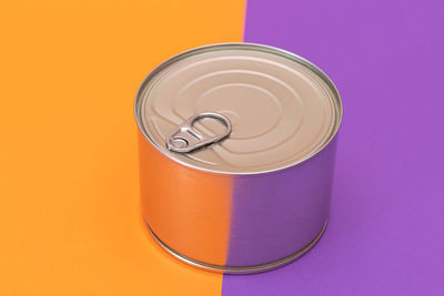 High angle view of red container against yellow background