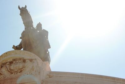 Low angle view of statue in front of sky