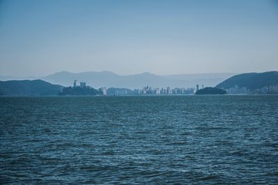 Scenic view of sea against clear blue sky