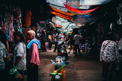 Group of people at market stall