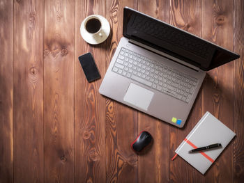 High angle view of coffee cup on table