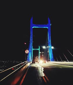 Illuminated road bridge at night