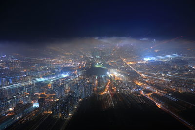 Aerial view of illuminated city at night