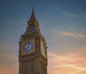 Low angle view of big ben against sky during sunset london 