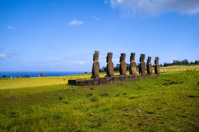 Old ruins on field against sky