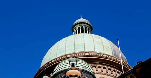 Low angle view of a building against blue sky