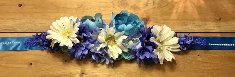 Close-up of purple flower vase on table