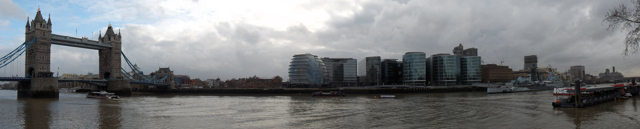 Boats in river with buildings in background