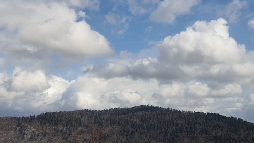 Low angle view of land against sky