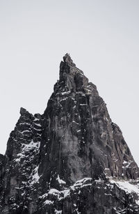 Low angle view of rock formation against clear sky