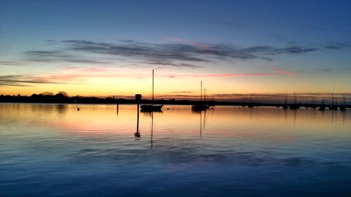 Scenic view of sea at sunset