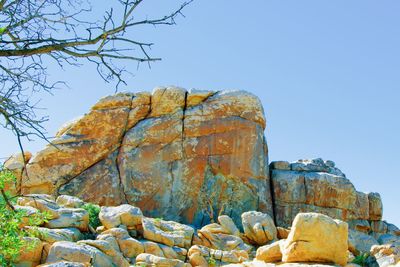 Rock formation on rocks against clear blue sky