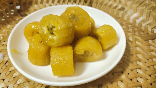 High angle view of fruits in plate on table