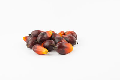 Close-up of tomatoes against white background