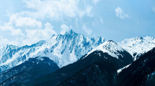 Panoramic view of snowcapped mountains against sky