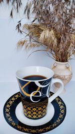 Close-up of coffee cup on table