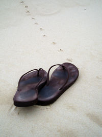 High angle view of shoes on sand